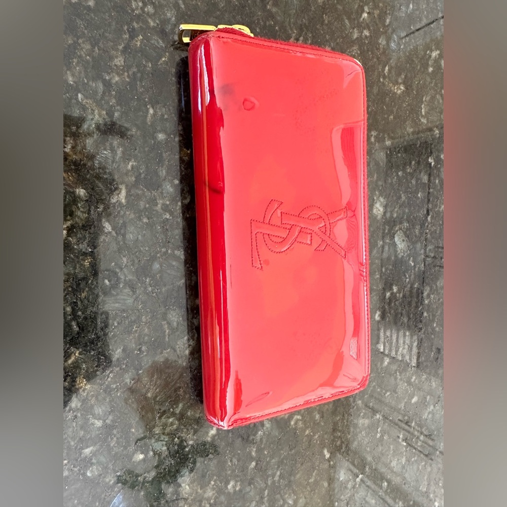 YSL wallet, gently used. Left corner has mark on it